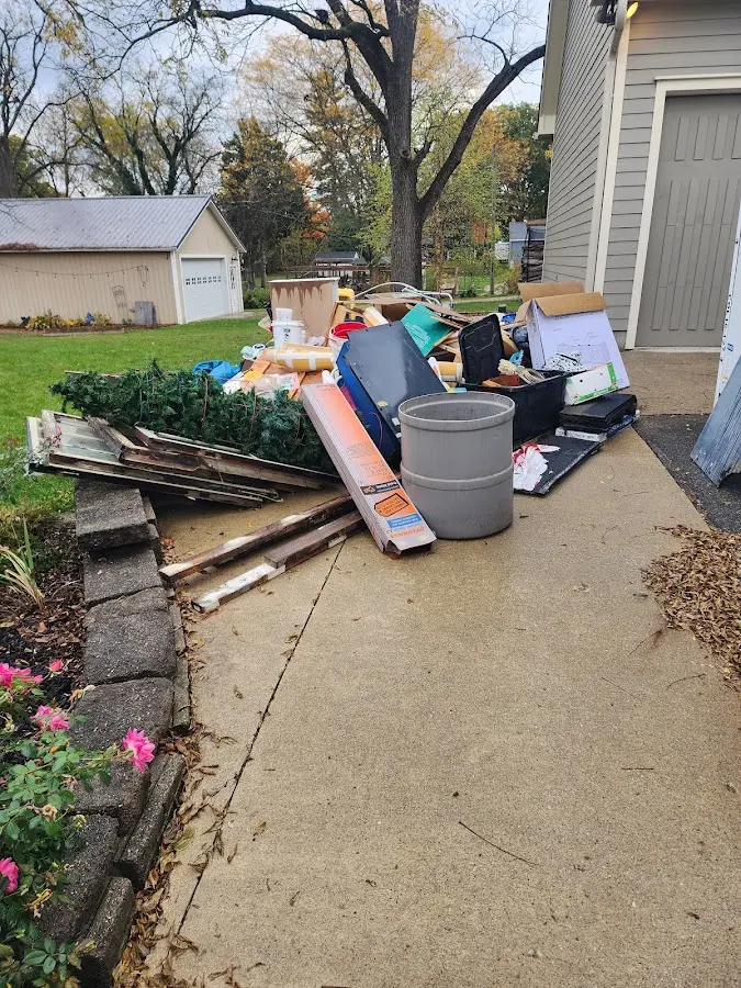 Dumpster being loaded with debris for 3 Yard Dumpster Rental in Camp Hill